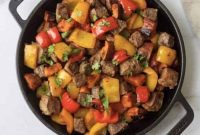 Whole30 Garlic Steak Bites with a Colorful Sweet Potato and Pepper Medley