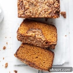 Slice of Paleo pumpkin bread with streusel topping
