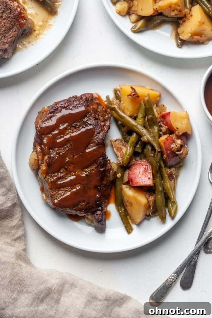 Steak and potatoes on a plate, showing a complete meal