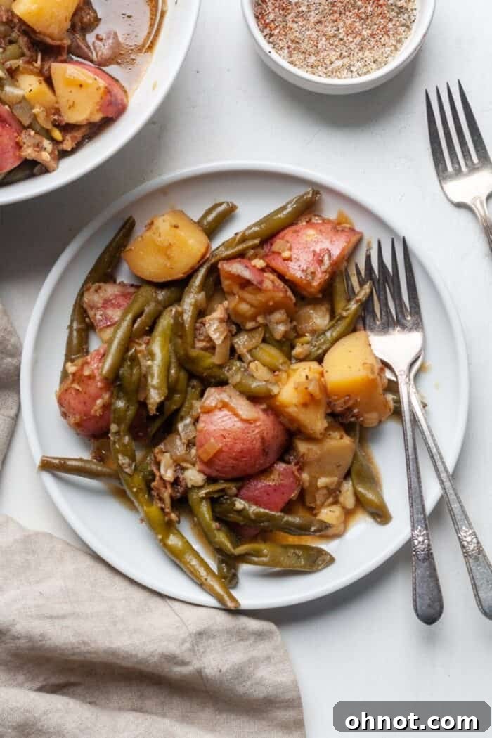 Red potatoes and green beans on a rustic plate, ready for cooking