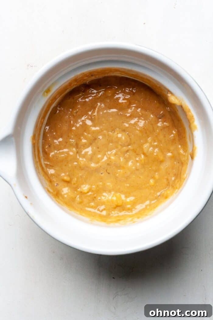 Smooth, healthy muffin batter in a mixing bowl.