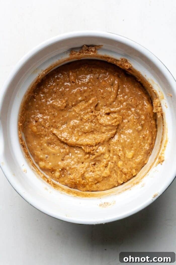 Thick, well-combined muffin batter in a bowl.