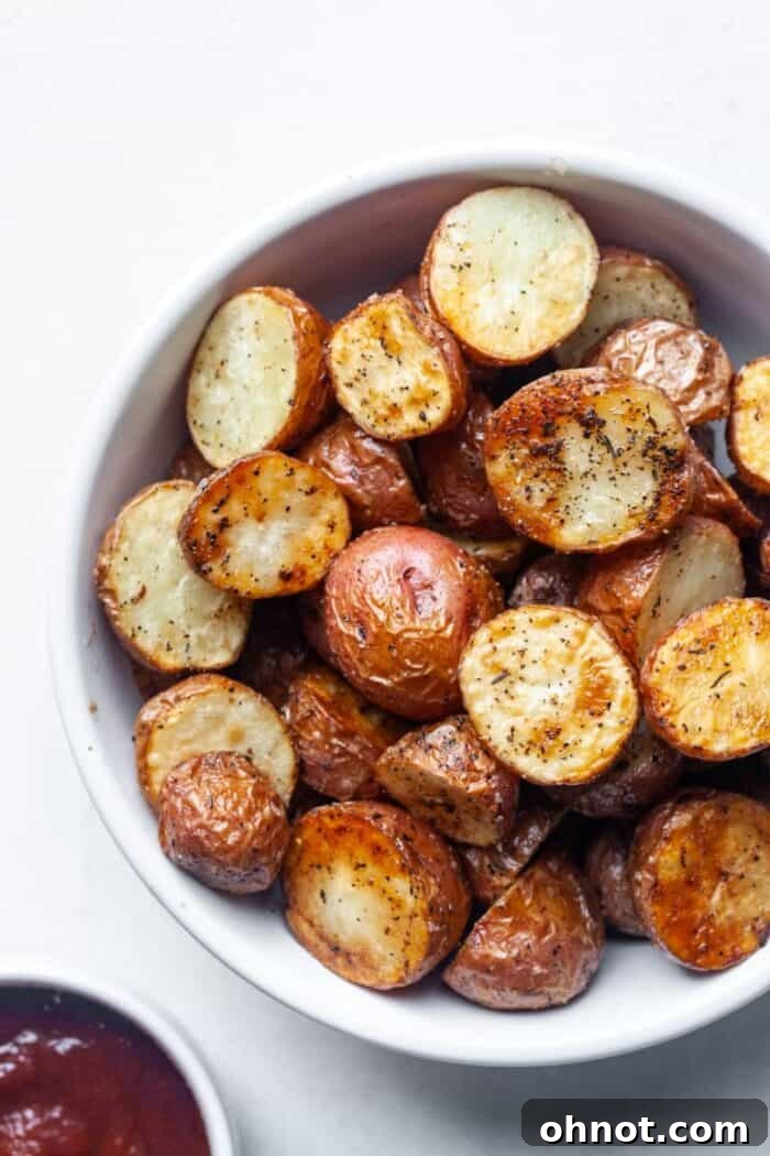 Bowl of freshly air-fried diced potatoes, showcasing their golden-brown color and crispy texture