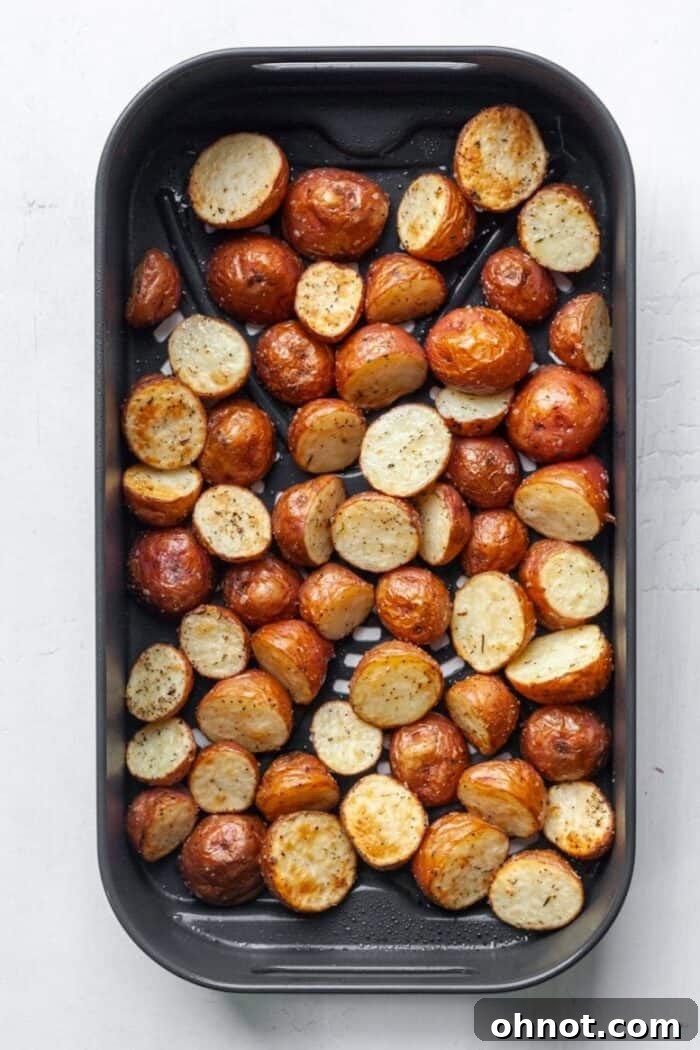 Crispy golden diced potatoes fresh out of the air fryer, glistening with seasoning