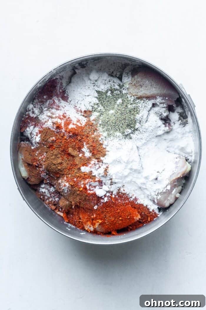 Chicken with spices in bowl