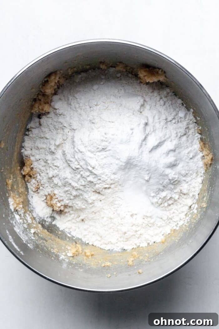 Dry ingredients, including flour, tapioca flour, and baking soda, measured out in a separate bowl.