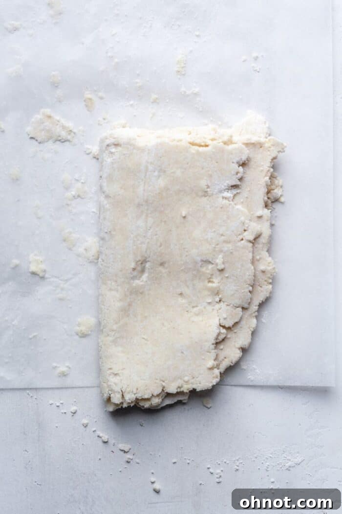 Folded dough on flour surface