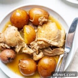 Instant Pot chicken thighs and potatoes on white plate