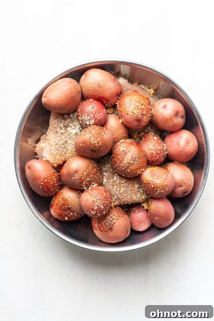 Red potatoes and chicken in bowl