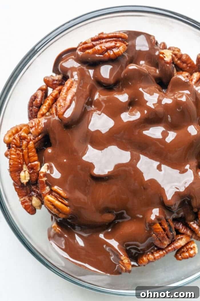 Melted chocolate and nuts in bowl