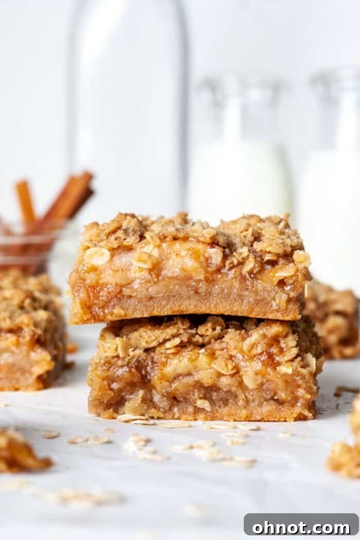 Apple crisp bars with crumble topping, glistening with sweet apple filling
