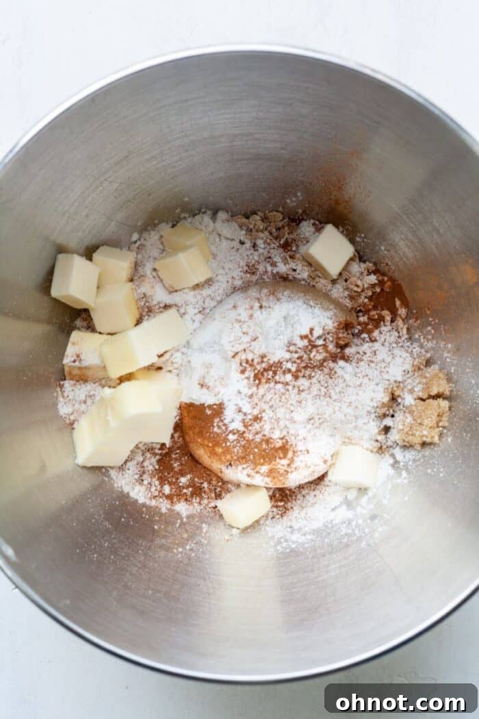 Butter, oats and sugar in bowl for crumble topping