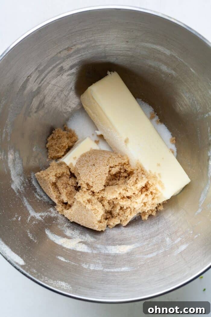 Butter and sugars in mixing bowl, ready to be creamed
