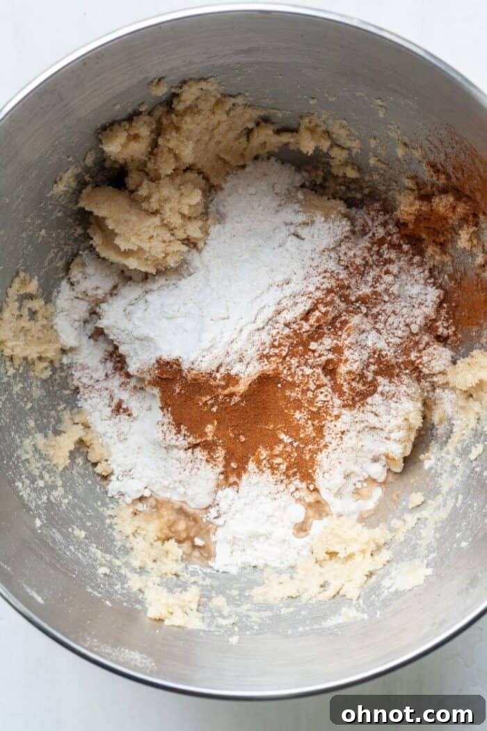 Flour, cinnamon, and shortbread dough in bowl