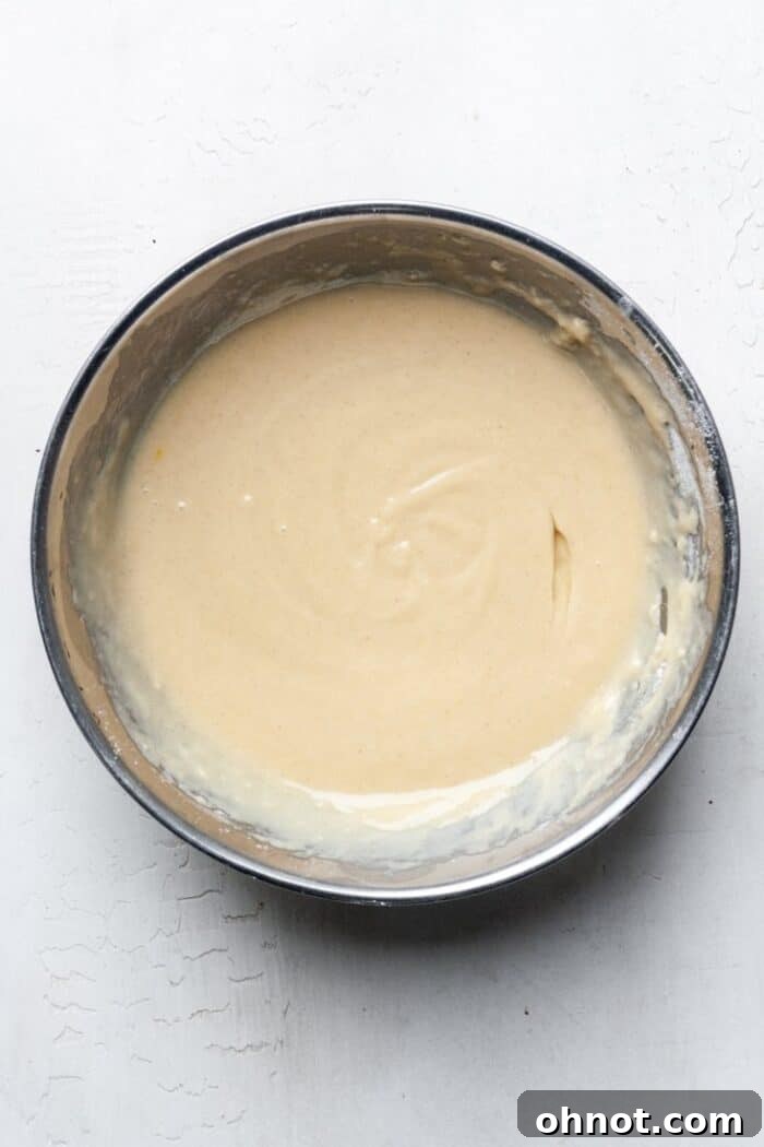 A closer look at the thin, flowing texture of the gluten-free donut batter.