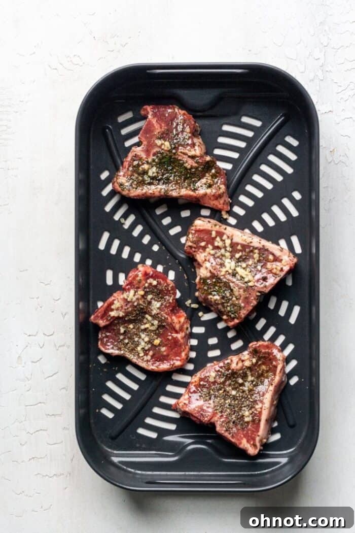 Lamb in air fryer basket, arranged in a single layer