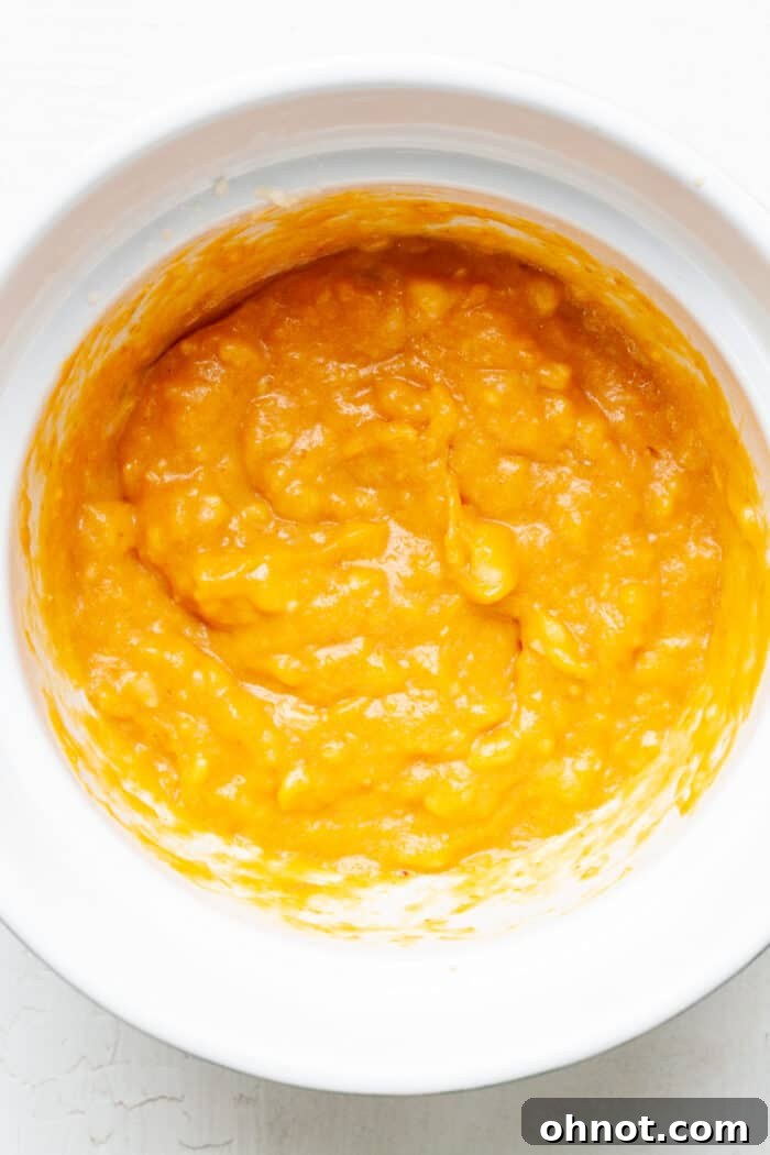 Creamy orange batter in bowl