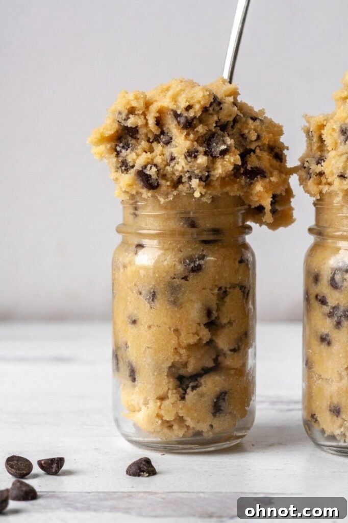 A bowl of edible cookie dough with various add-ins, showcasing versatility.