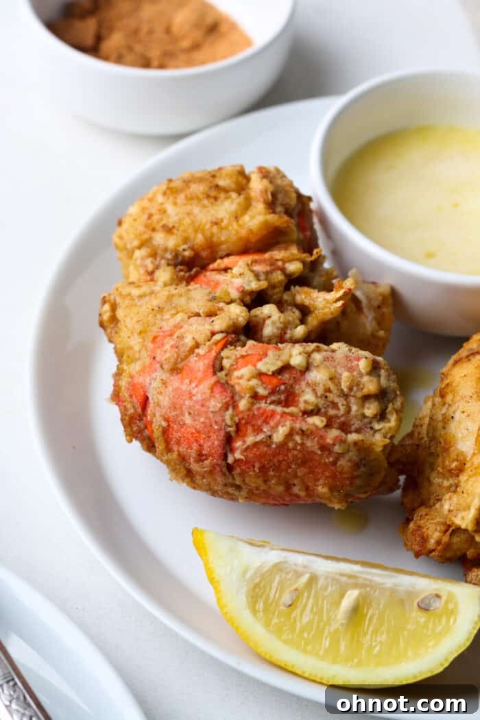 Fried lobster tails with lemon and garlic butter, perfectly golden and crispy.
