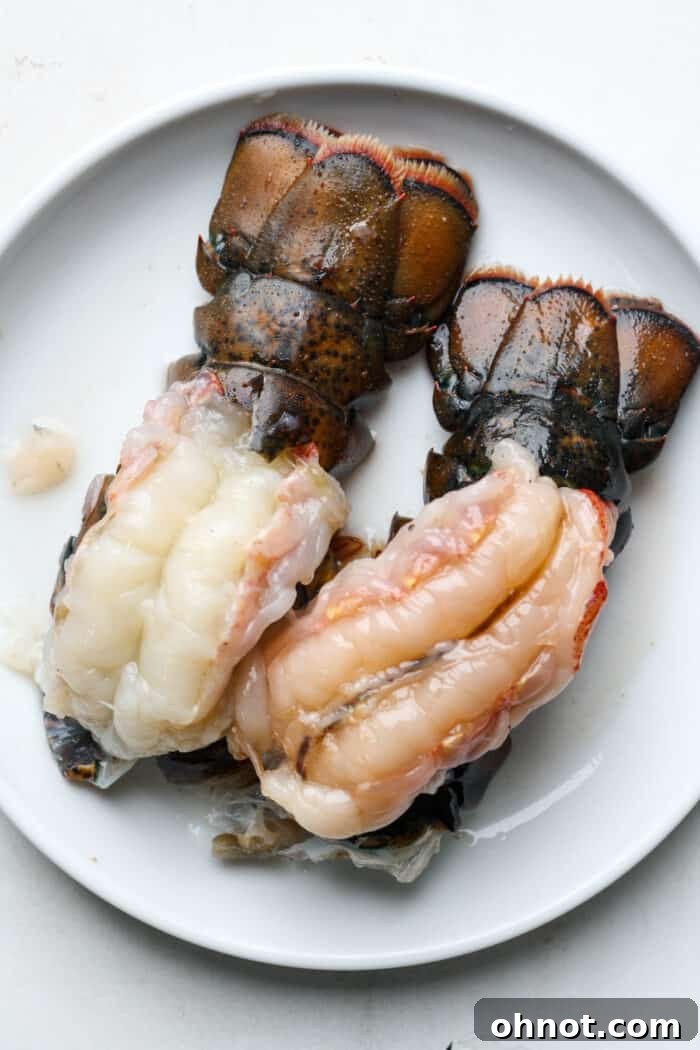 Butterflied lobster tails with the succulent white flesh lifted and resting on the red shells.