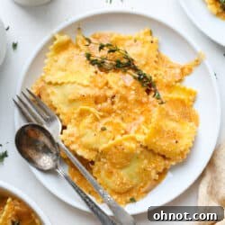 Creamy lobster ravioli sauce on white plate
