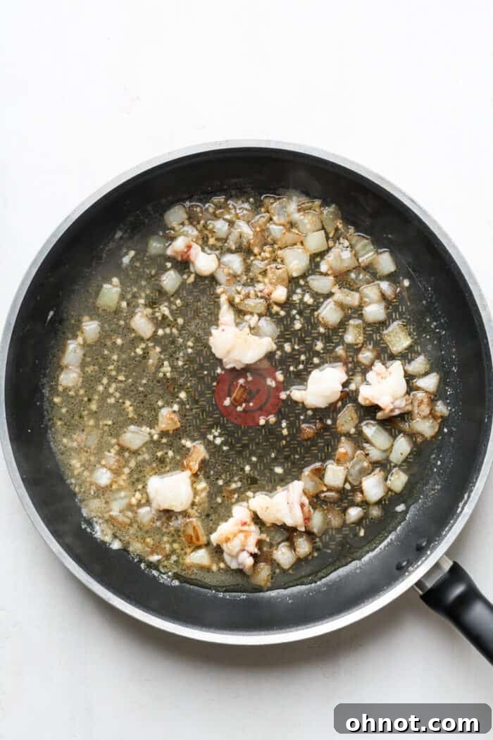 White wine vinegar added to the skillet with lobster and onions.