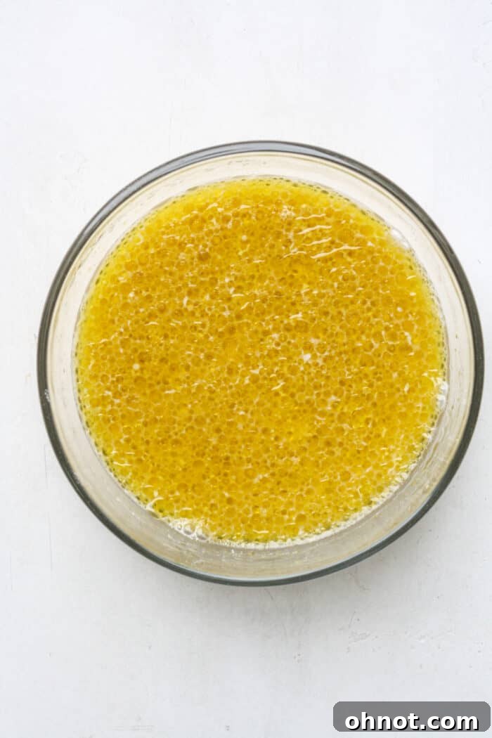 Wet ingredients, including oil and curdled milk, in a bowl.
