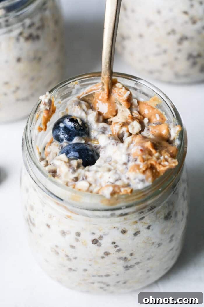 Jar of protein overnight oats with blueberries and peanut butter