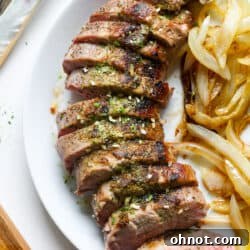 Sous vide pork tenderloin on white plate