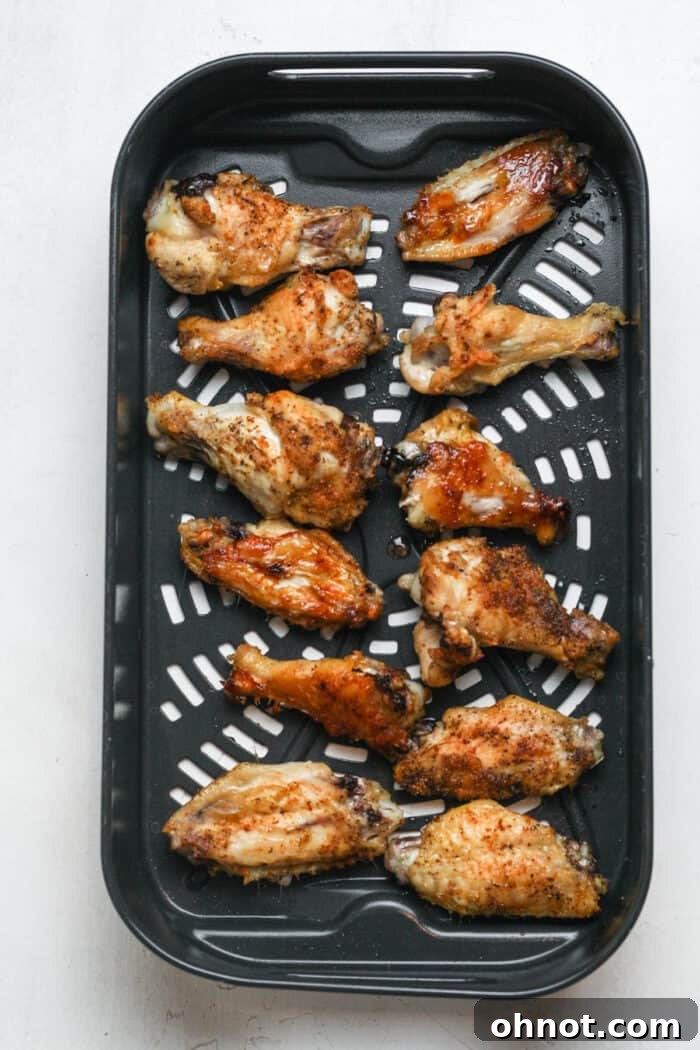 Golden chicken in air fryer basket