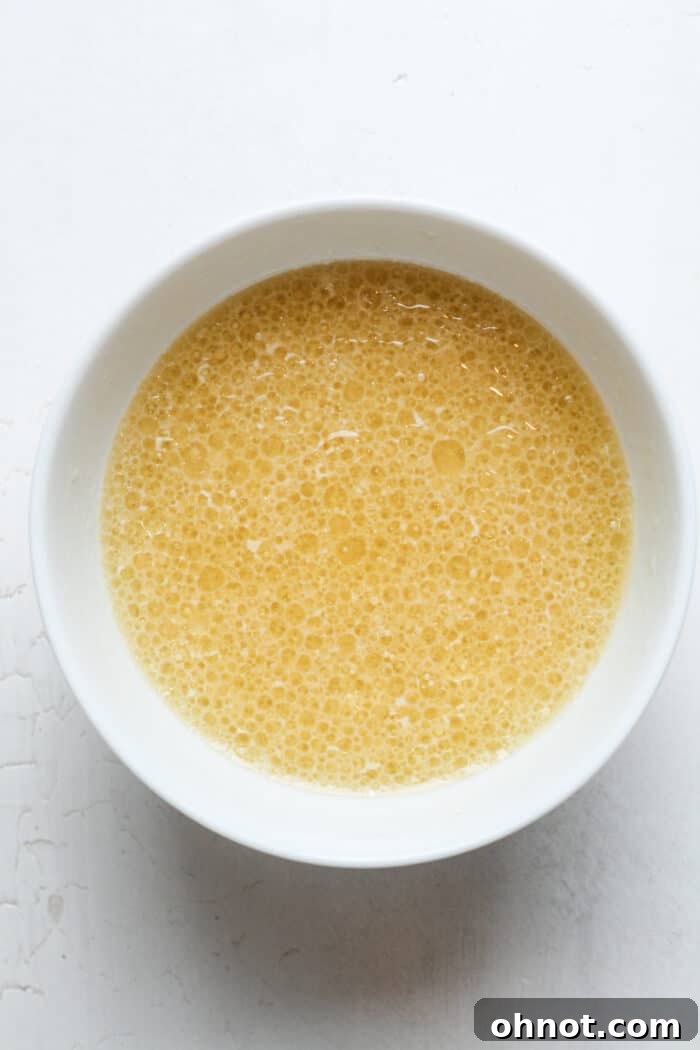 Avocado oil, vanilla extract, and lemon juice in a bowl.