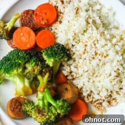 Sausage stir fry on white plate