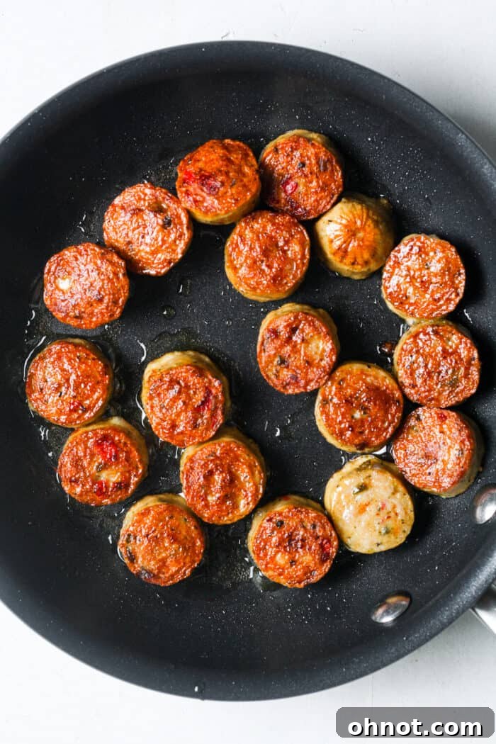 Perfectly cooked and browned sausage slices in the skillet