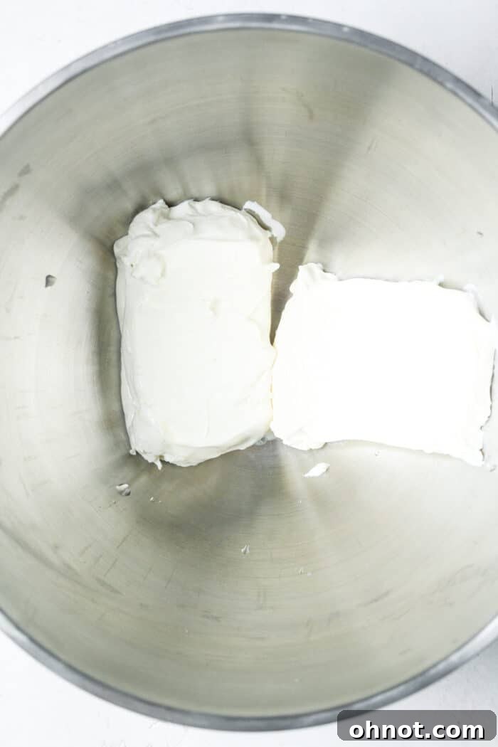 Blocks of cream cheese in pan