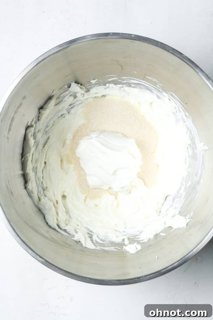 Cream cheese and sugar in bowl
