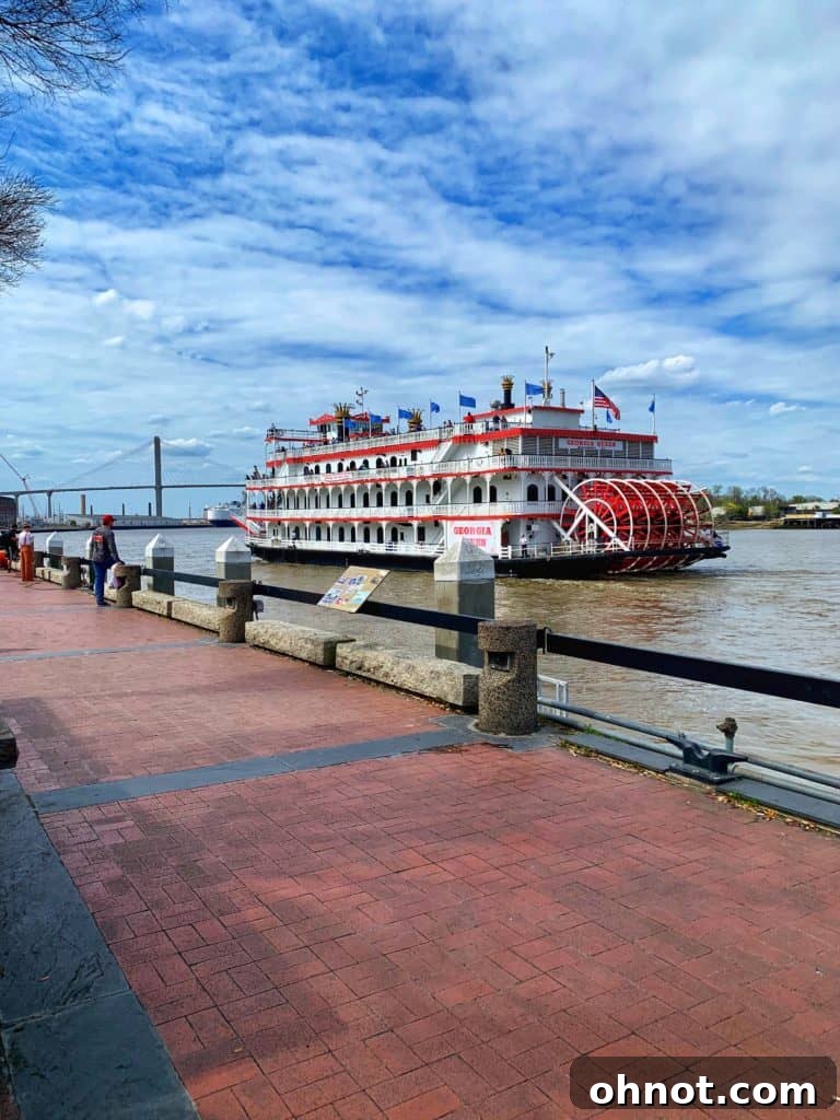 Historic waterfront district of Savannah, showcasing beautiful old buildings, cobblestone streets, and a view of the river.
