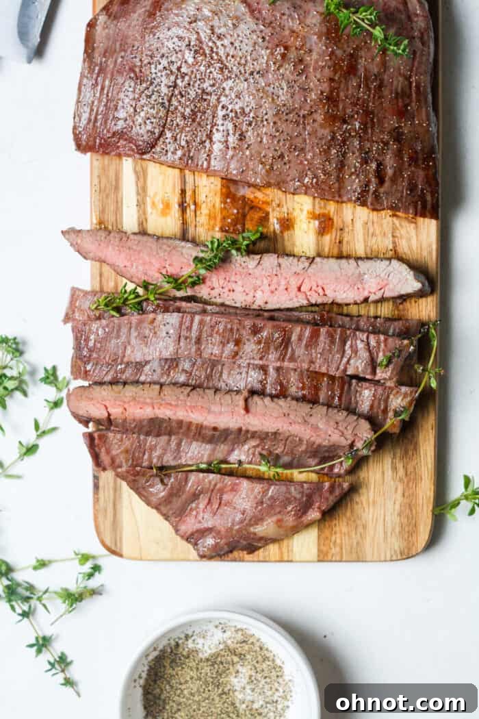 Sliced steak on cutting board