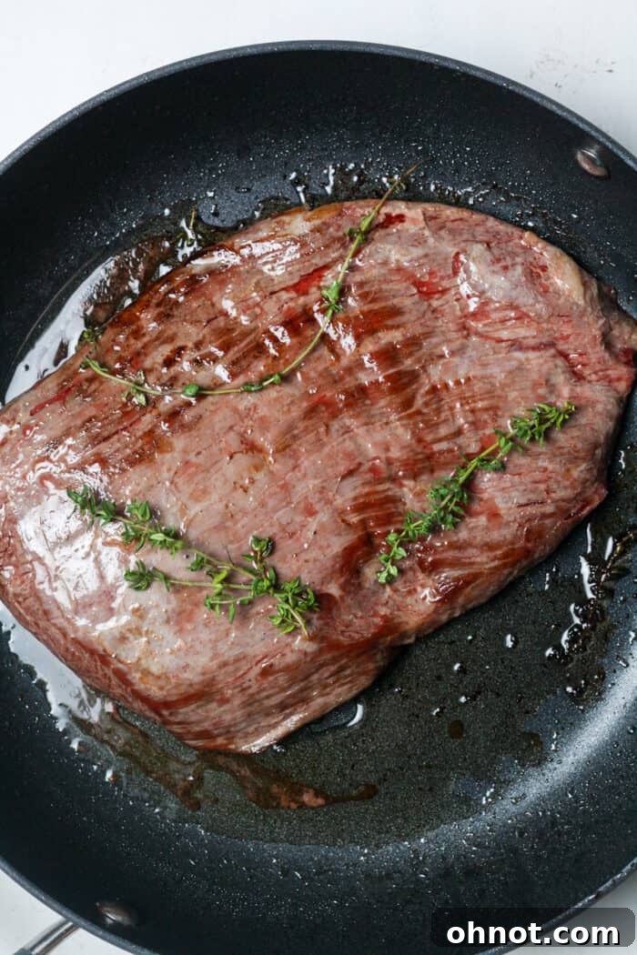 Seared steak in pan