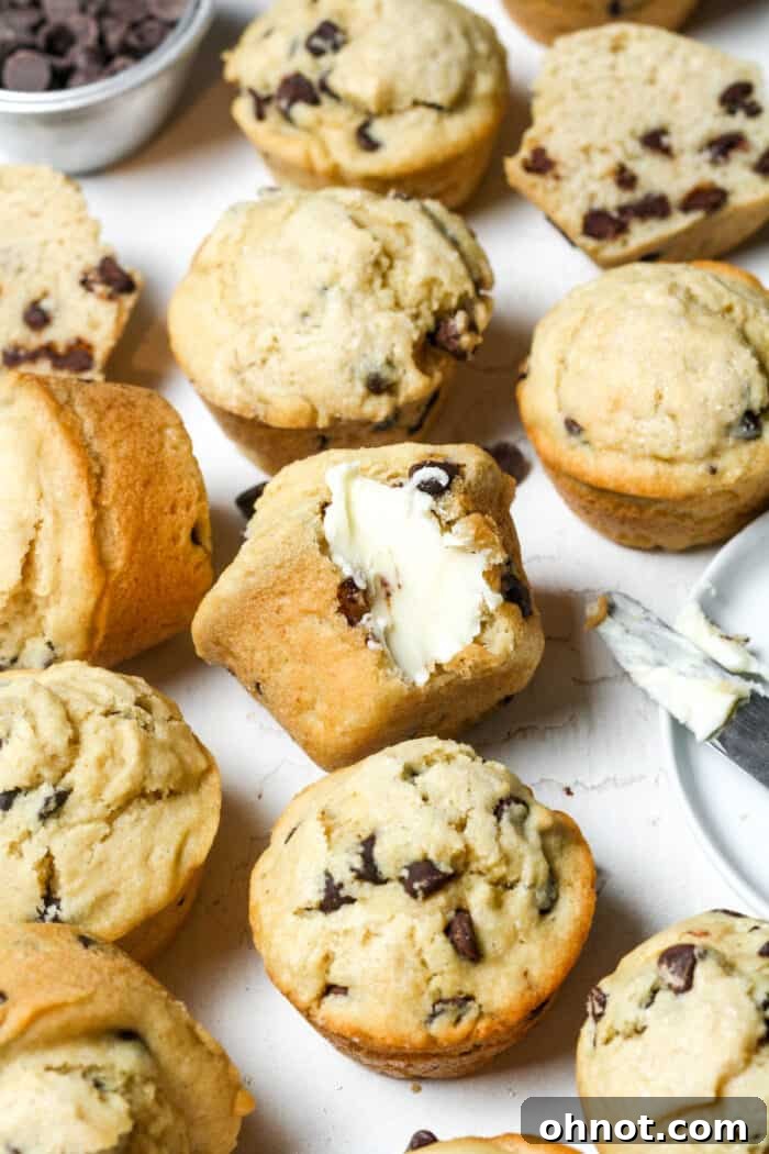 A delightful arrangement of gluten-free chocolate chip muffins, some with butter, showcasing their perfect texture.