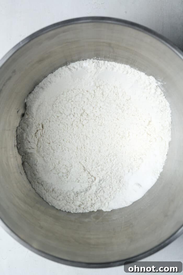 Dry ingredients for muffins, perfectly mixed in a large bowl.