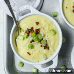 A bowl of creamy 4-ingredient potato soup with vibrant toppings.