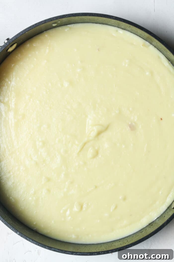 A creamy, blended potato soup in a large skillet, ready to be served.