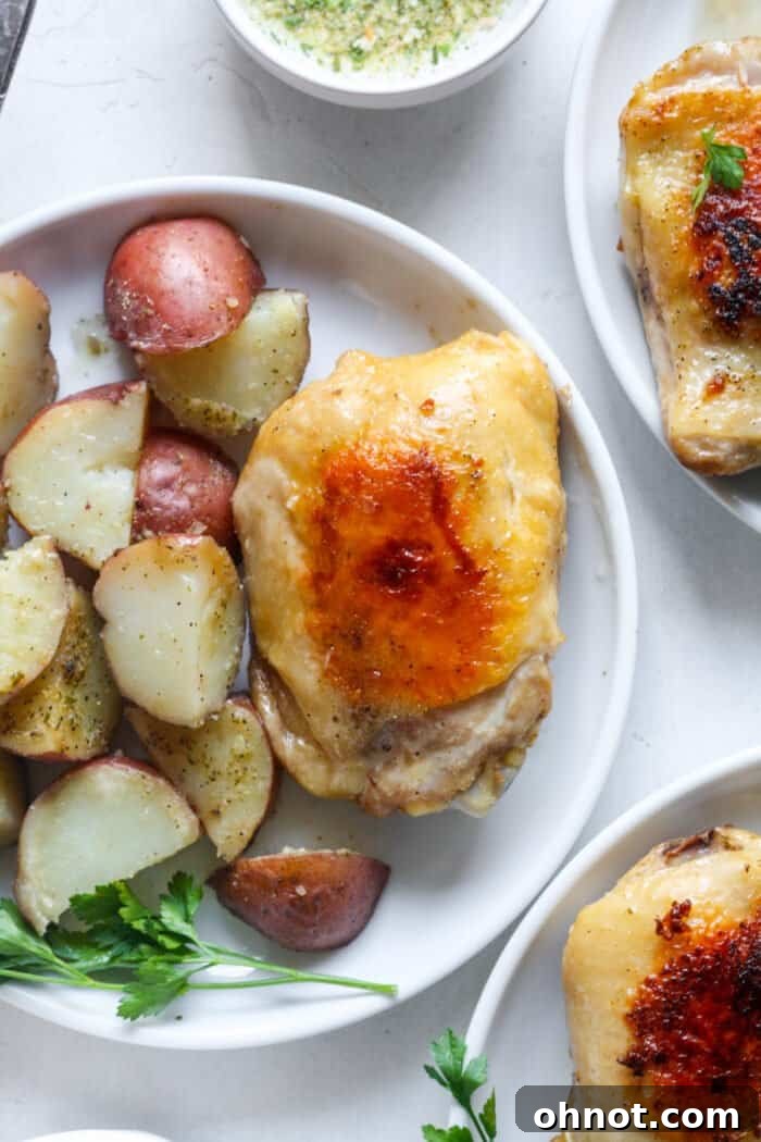Chicken with tender sous vide potatoes served on a white plate