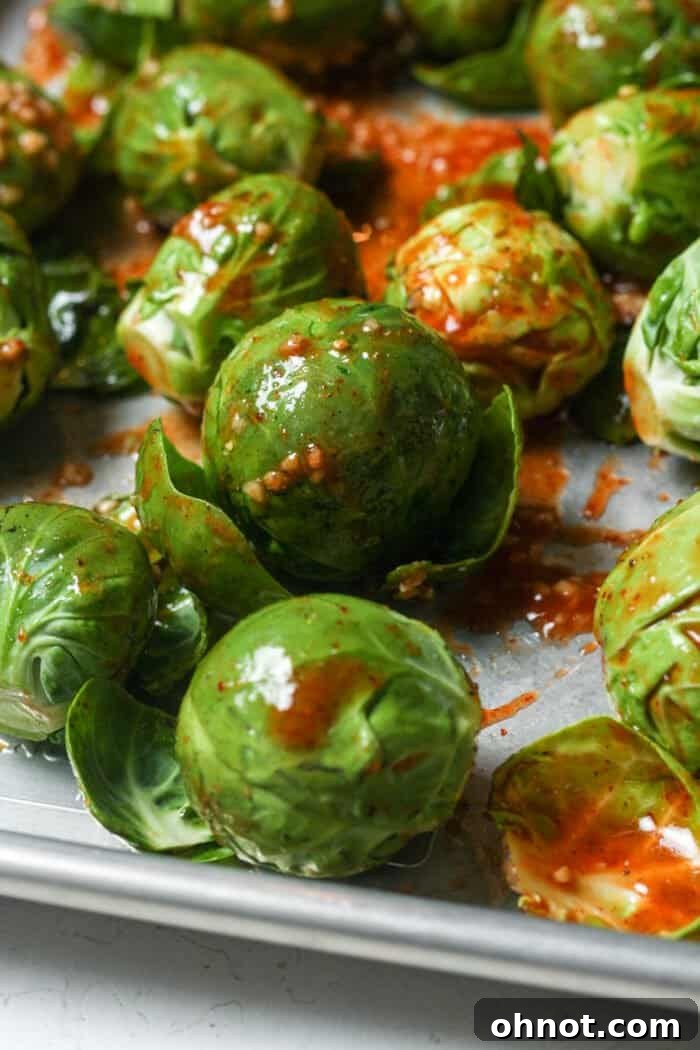 Spicy Brussels sprouts on pan, ready for the oven