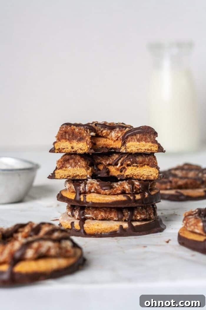 Close-up of a single Samoa cookie showing its layers.