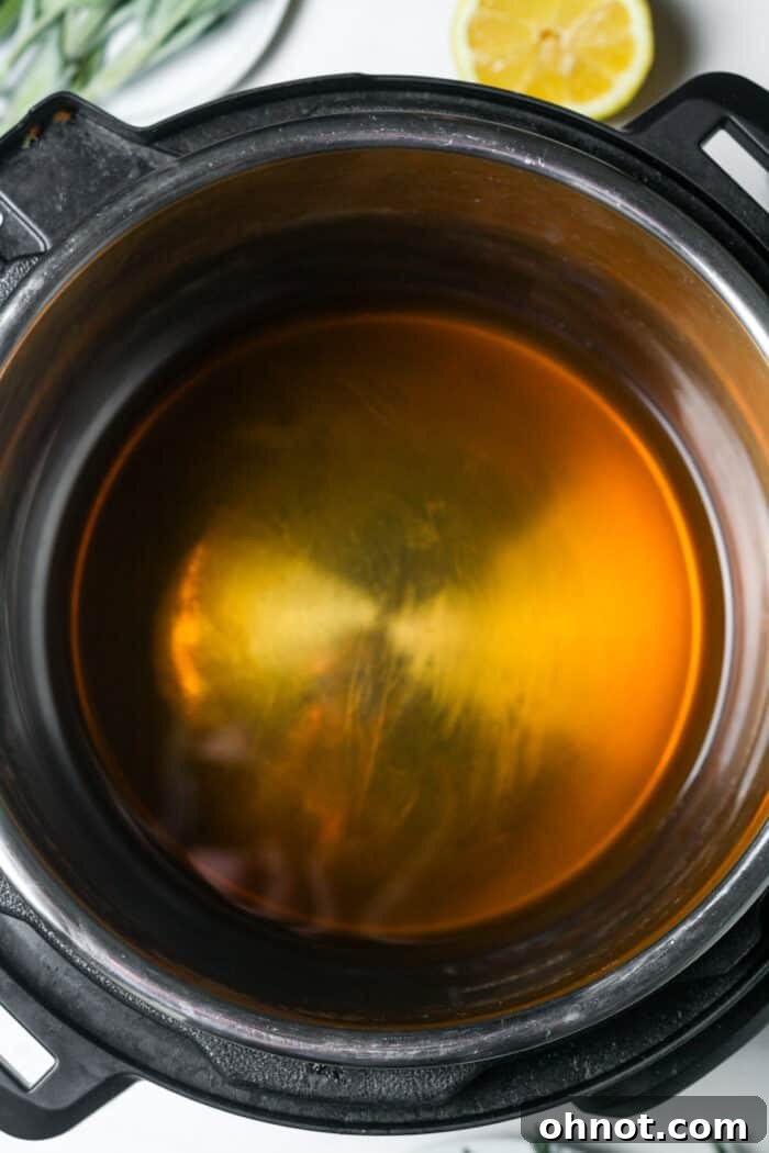 Chicken broth poured into Instant Pot liner
