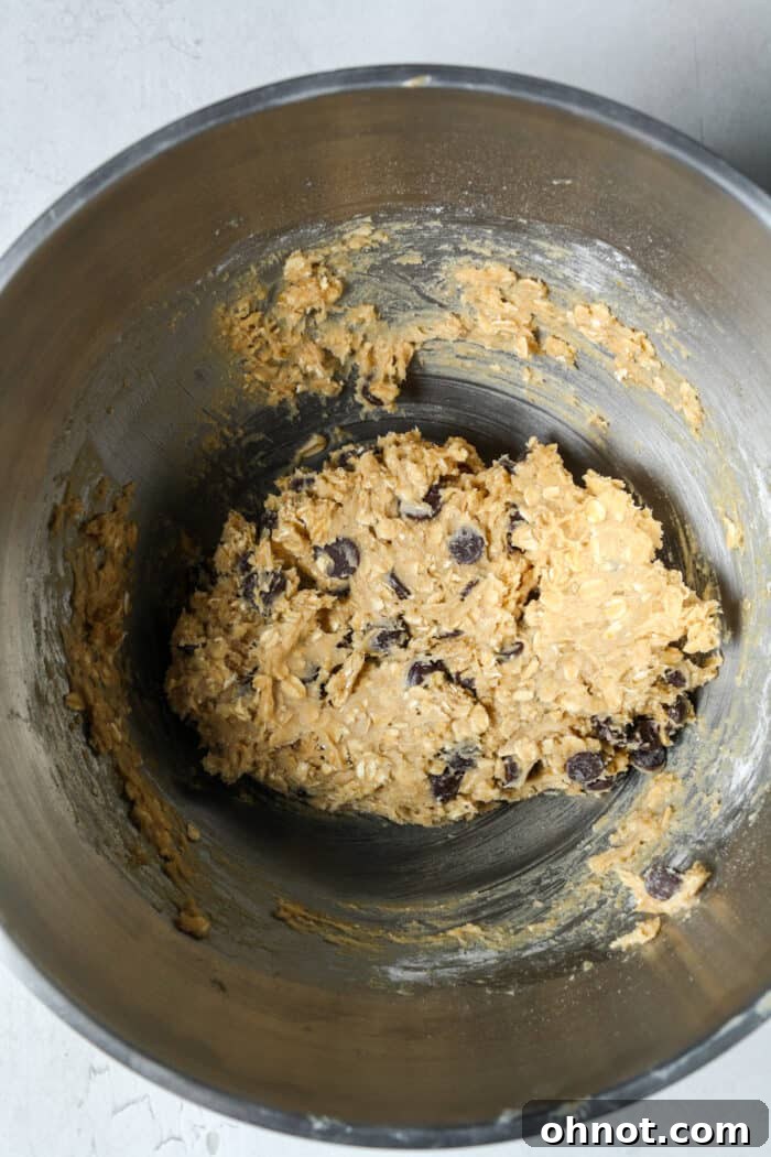 Thick oatmeal bar batter with chocolate chips, ready for the pan.