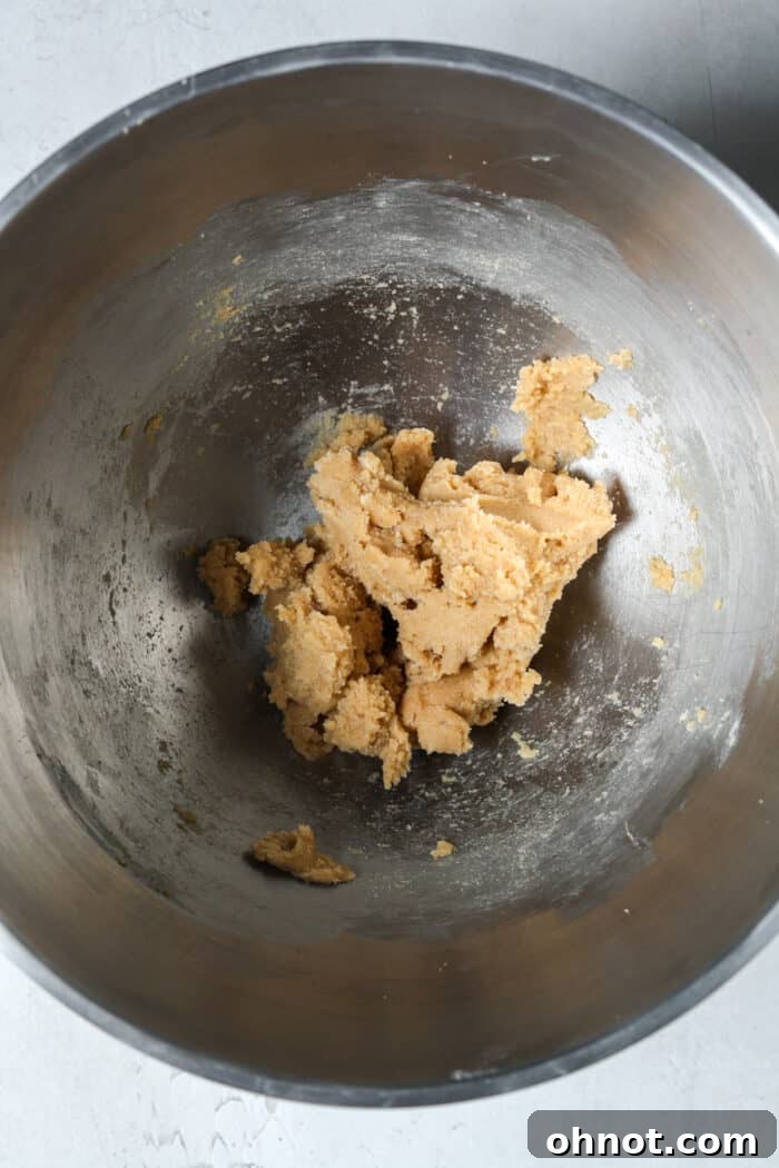 Creamed butter and sugars in a mixing bowl, light and fluffy.