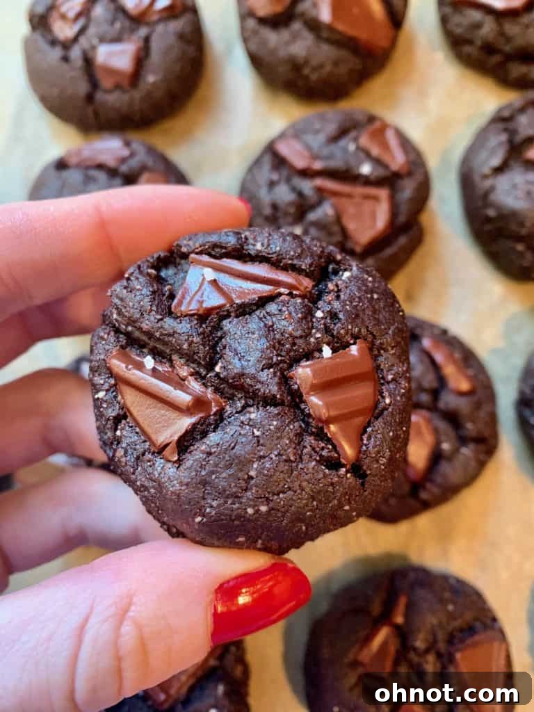 Deliciously soft and pillowy chocolate mint cookies on a baking sheet, ready to be enjoyed.