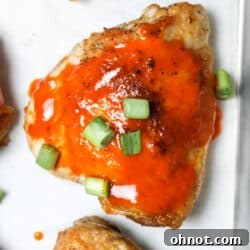 Buffalo chicken thighs on pan